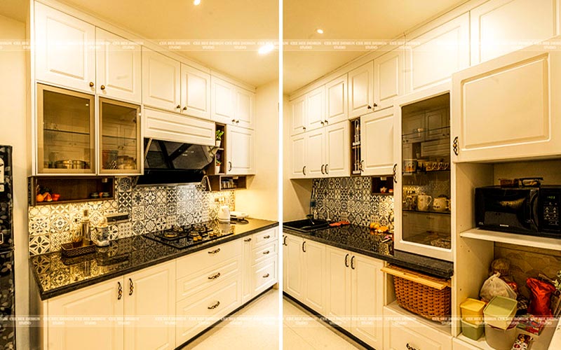 A modern kitchen with sleek countertops, stainless steel appliances, and pendant lights hanging above the island.