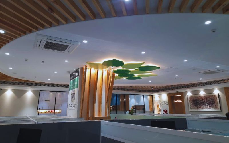 Sleek office interior with a wooden ceiling design, reflecting the talent of interior decorators based in Kolkata.