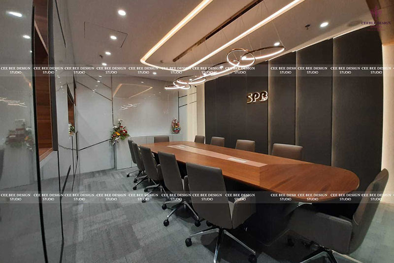 A professionally designed conference room with a large table and chairs by commercial interior designers.