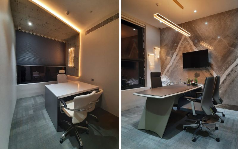 Two views of an office space highlighting a desk and television, created by office interior designers based in Bangalore.