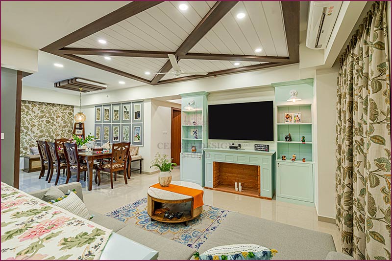 A stylish living room with a dining table and chairs, showcasing modern home interior design.