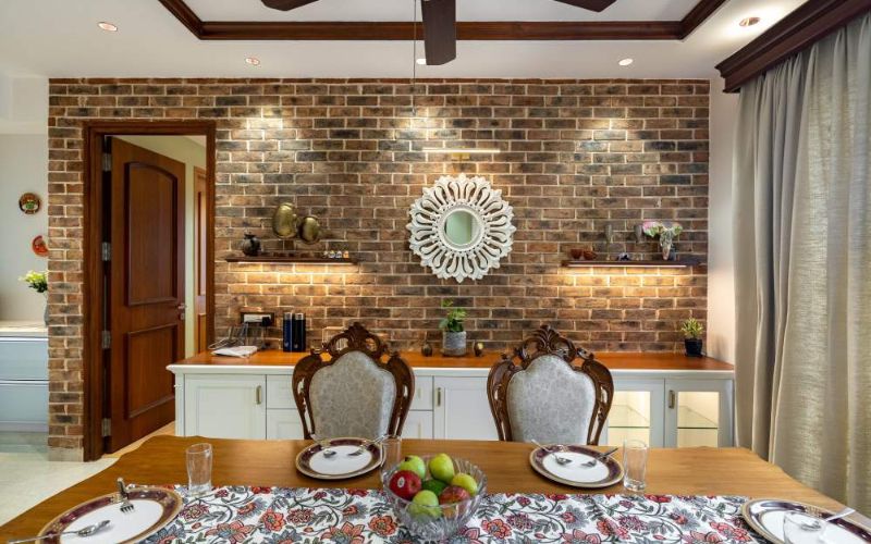 Contemporary living room with white walls and wooden floors, designed by a professional interior designer in Kolkata.