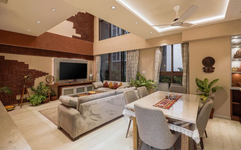 A sleek living room with a large flat-screen TV, reflecting the expertise of Kolkata's finest interior decorators.