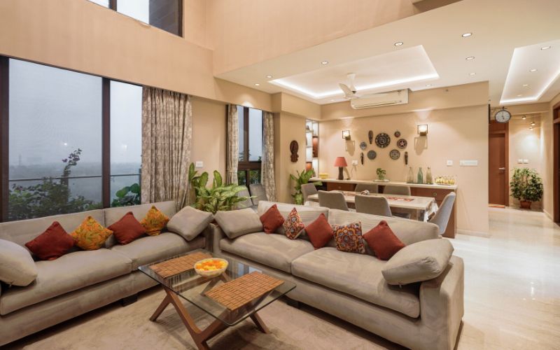 An elegant living room with plush couches and a chic table, reflecting contemporary interior design from Kolkata.