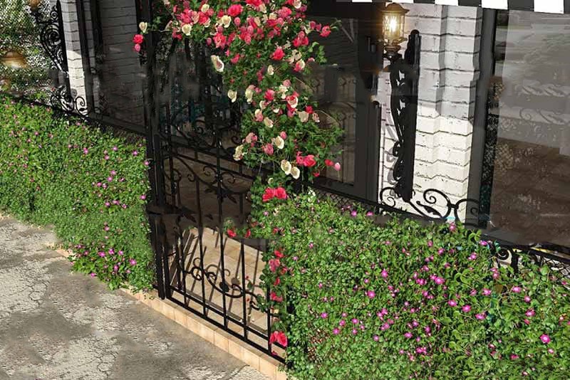 Interior designing company in Bangalore creates a garden with flowers and a gate.