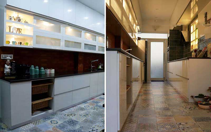 A luxurious kitchen featuring a long counter and a sleek sink, designed by a premier interior design company in Bangalore.