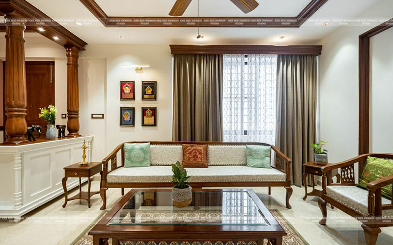 Cozy living room featuring wooden furniture and a ceiling fan.