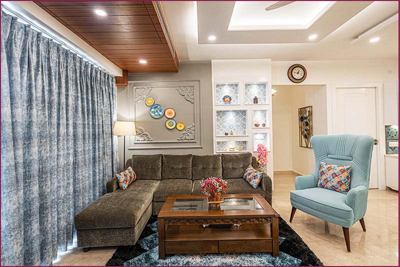 Blue furniture and coffee table in a living room, showcasing home interior design.